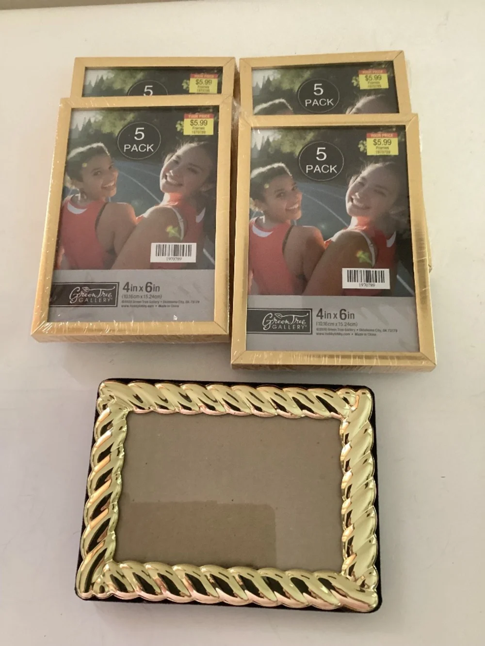 5 4x6 inch brass photo frames, 4 new/old stock in pkg. one pre owned